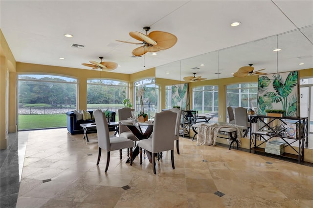 interior space featuring a wealth of natural light and ceiling fan