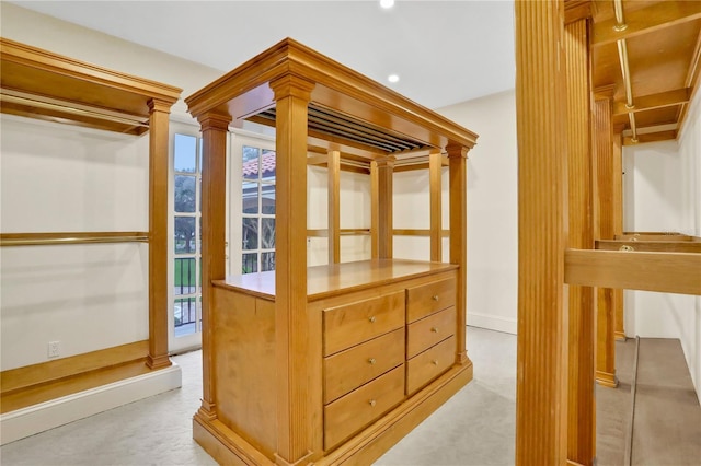 spacious closet with decorative columns