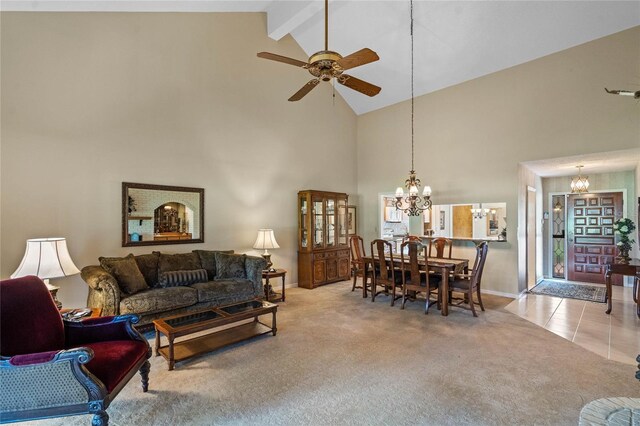 living room featuring light colored carpet, ceiling fan with notable chandelier, beam ceiling, and high vaulted ceiling