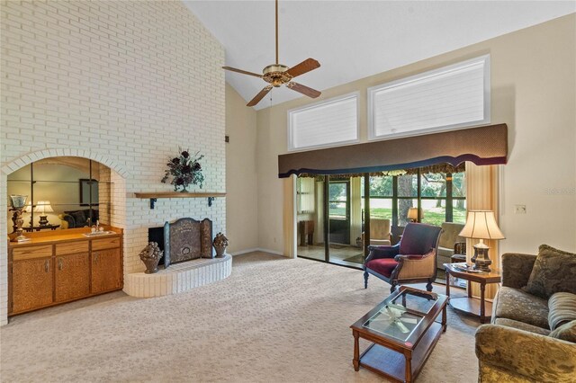 living room featuring a brick fireplace, carpet floors, high vaulted ceiling, and ceiling fan