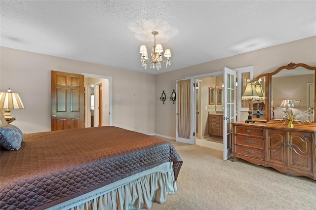 carpeted bedroom with an inviting chandelier, connected bathroom, and a textured ceiling