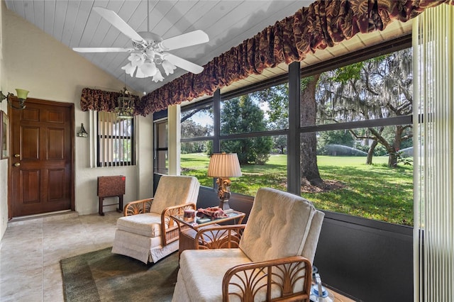 sunroom / solarium featuring ceiling fan, lofted ceiling, and wooden ceiling