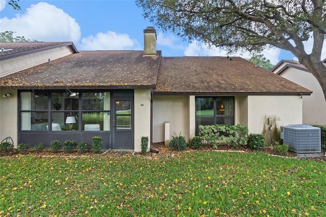 exterior space featuring a lawn and cooling unit