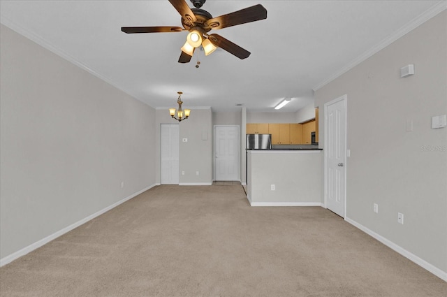 unfurnished living room featuring ceiling fan with notable chandelier, ornamental molding, and light colored carpet