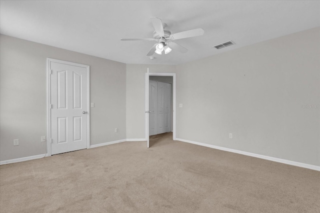 unfurnished bedroom featuring ceiling fan and light carpet