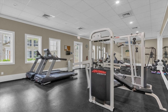 gym featuring a paneled ceiling