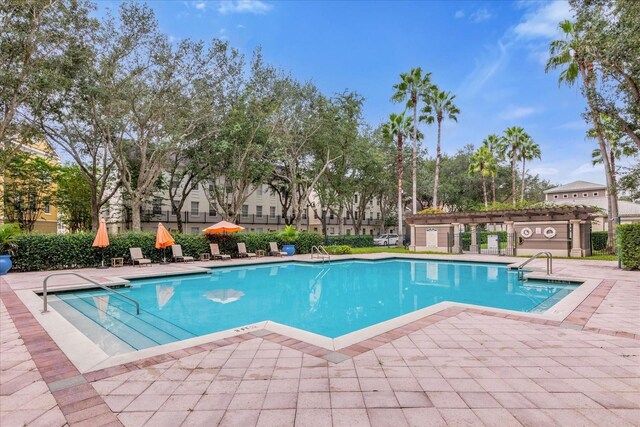 view of swimming pool featuring a patio