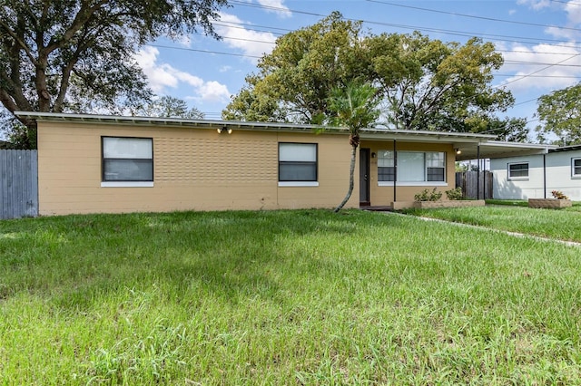 rear view of house with a yard