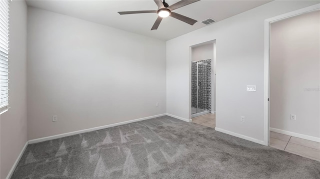 unfurnished room featuring ceiling fan and light colored carpet