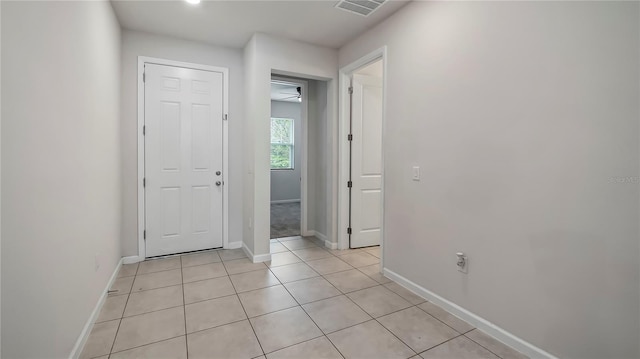 corridor with light tile patterned floors