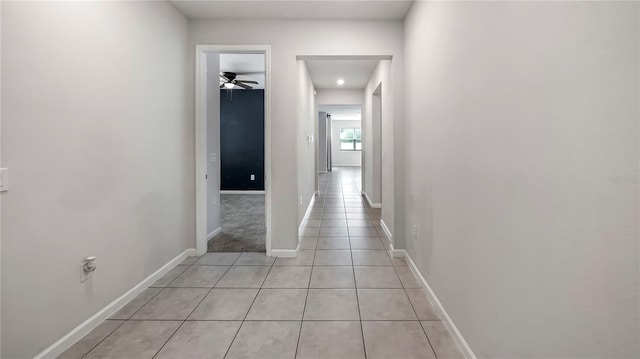 hallway featuring light tile patterned flooring