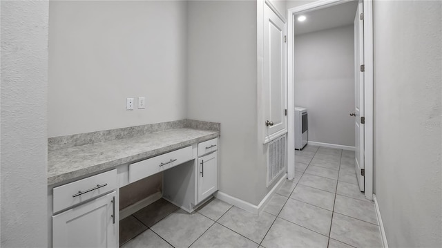 laundry room featuring light tile patterned flooring