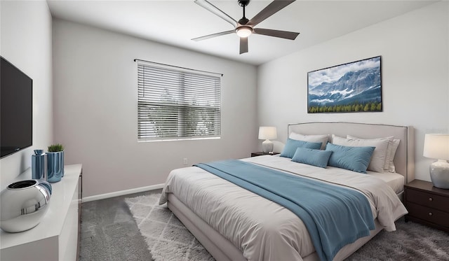 bedroom with dark colored carpet and ceiling fan