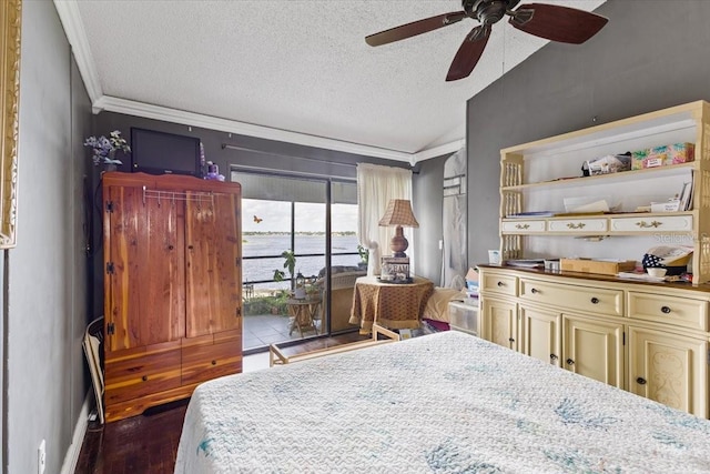 bedroom featuring ceiling fan, a textured ceiling, dark hardwood / wood-style floors, and access to outside