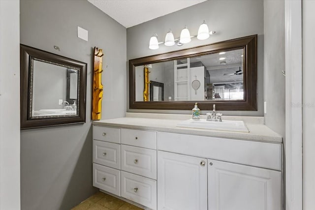 bathroom featuring vanity and a textured ceiling