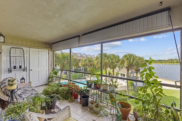 sunroom / solarium with a water view