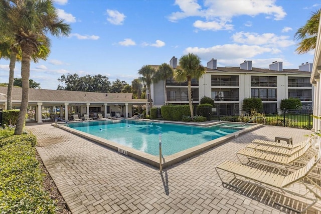 view of swimming pool with a patio