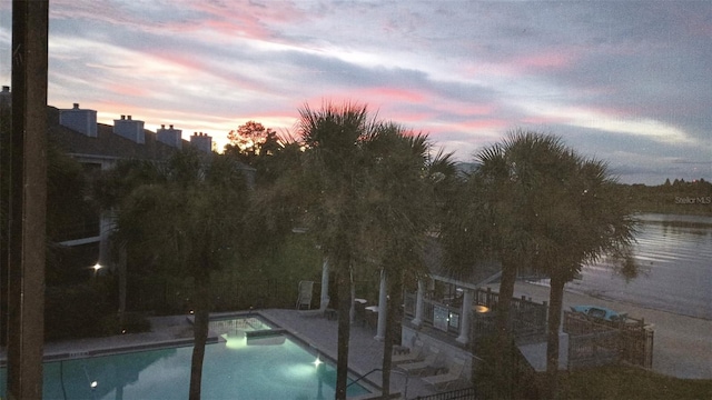 4113 Fairview Vista Pt Unit 308, Orlando, FL 32804 - pool at dusk featuring a patio area and a pool with connected hot tub