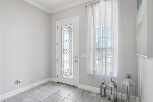 foyer featuring light tile patterned flooring and ornamental molding