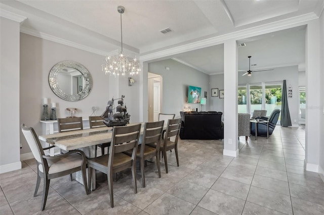 dining room with ceiling fan with notable chandelier, ornamental molding, and light tile patterned floors