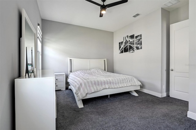 bedroom with dark colored carpet and ceiling fan