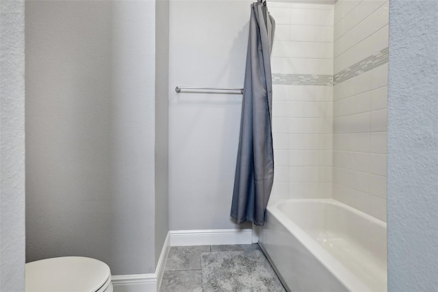 bathroom with shower / bath combination with curtain, toilet, and tile patterned floors