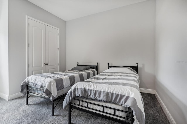 bedroom with a closet and carpet flooring