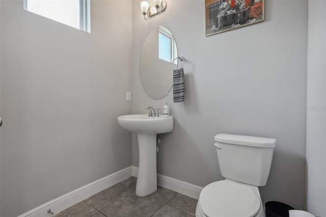 bathroom featuring tile patterned floors and toilet