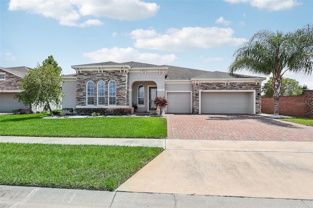 view of front of house featuring a front yard and a garage