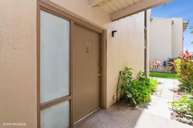 property entrance with a patio area