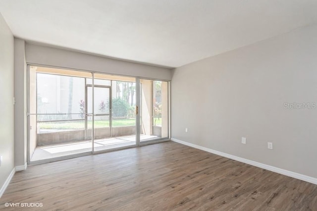 empty room featuring hardwood / wood-style flooring