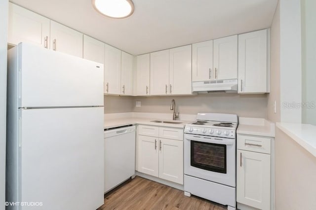 kitchen featuring light hardwood / wood-style flooring, sink, white appliances, and white cabinetry