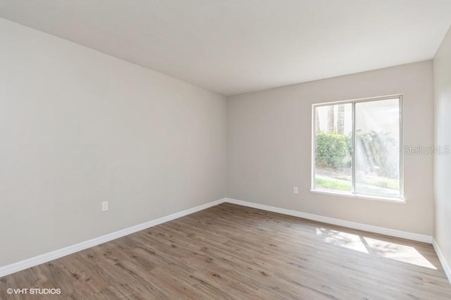 spare room featuring light hardwood / wood-style flooring