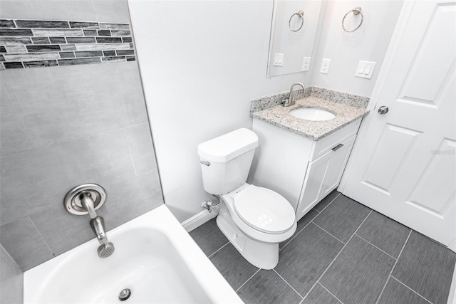 bathroom featuring tile patterned flooring, a bathing tub, toilet, and vanity