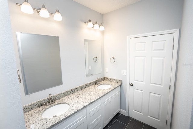 bathroom with vanity and tile patterned flooring