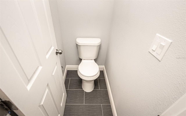 bathroom featuring tile patterned floors and toilet