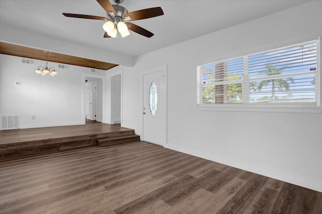 entrance foyer with ceiling fan with notable chandelier and hardwood / wood-style floors