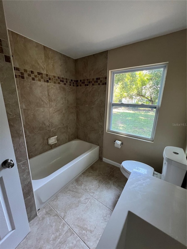 bathroom featuring tile patterned flooring and toilet