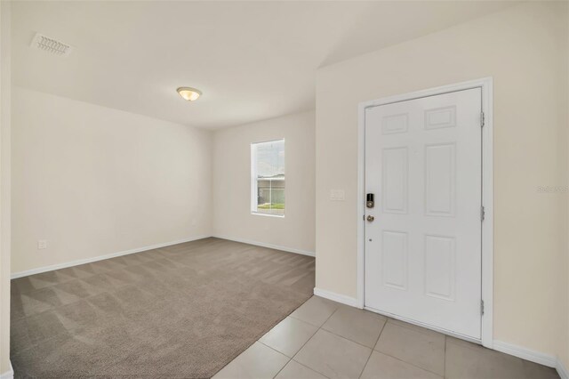 view of carpeted foyer