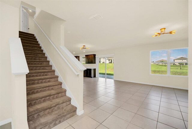 stairs featuring tile patterned floors