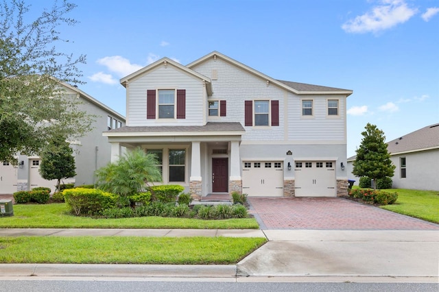 view of front of property with a garage and a porch