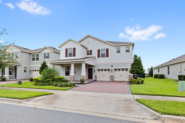 view of front facade featuring a garage and a front lawn