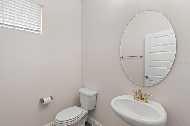 bathroom featuring sink and toilet