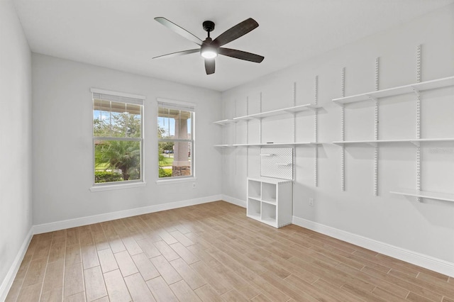 spare room with ceiling fan and light hardwood / wood-style floors