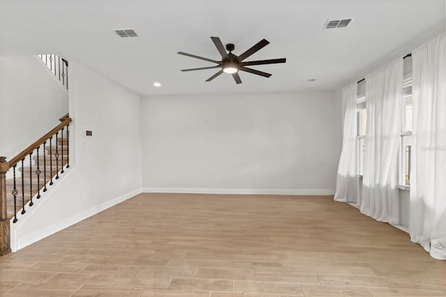 unfurnished room featuring light hardwood / wood-style floors, plenty of natural light, and ceiling fan