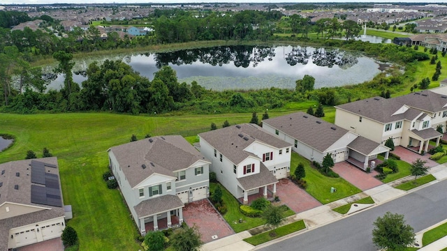 birds eye view of property with a water view