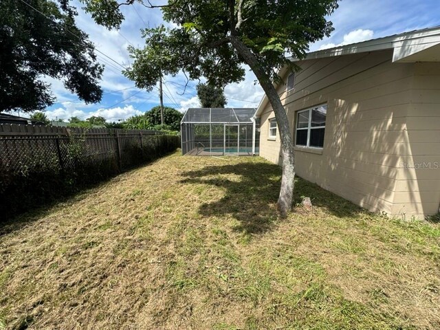 view of yard with a lanai