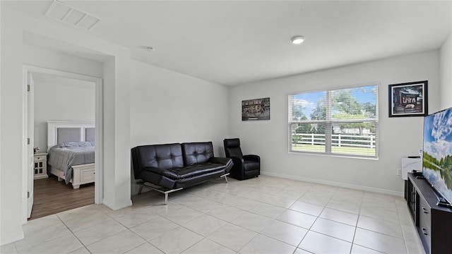 sitting room with light tile patterned floors