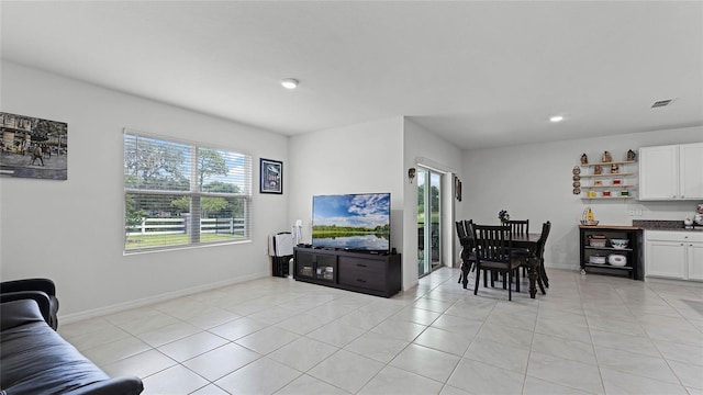 living room featuring light tile patterned flooring