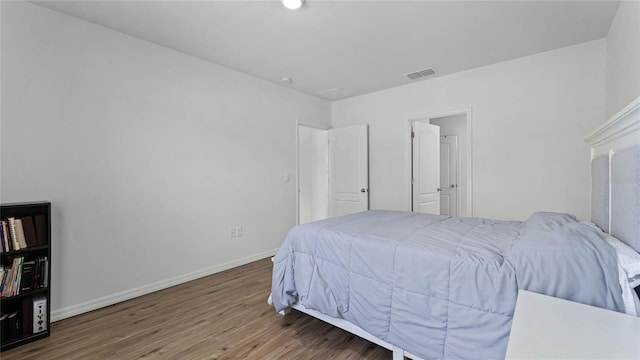 bedroom with hardwood / wood-style floors